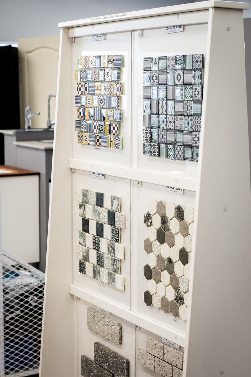 Mosaic and patterned tile samples on a display stand