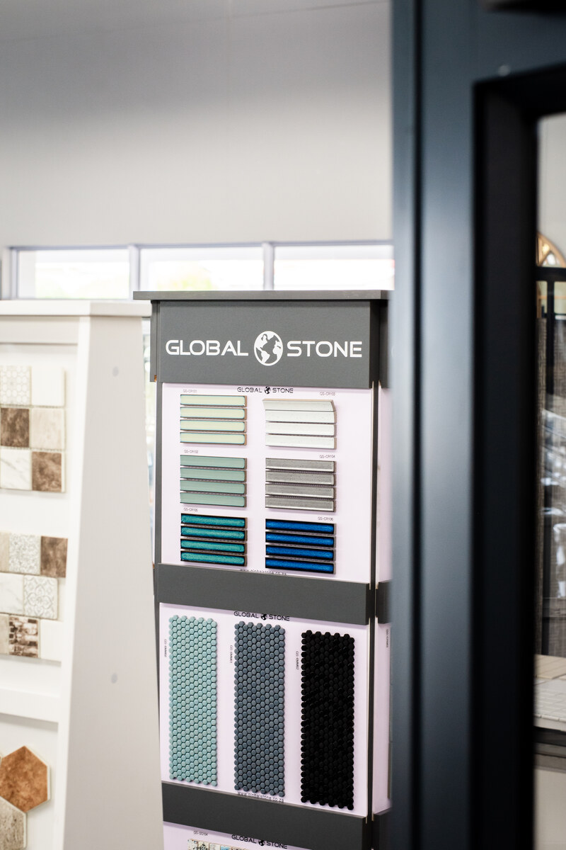 Global Stone tile samples on a display stand