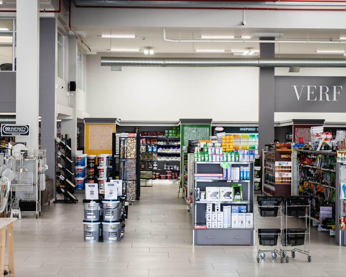 Main showroom aisle leading to the paint section