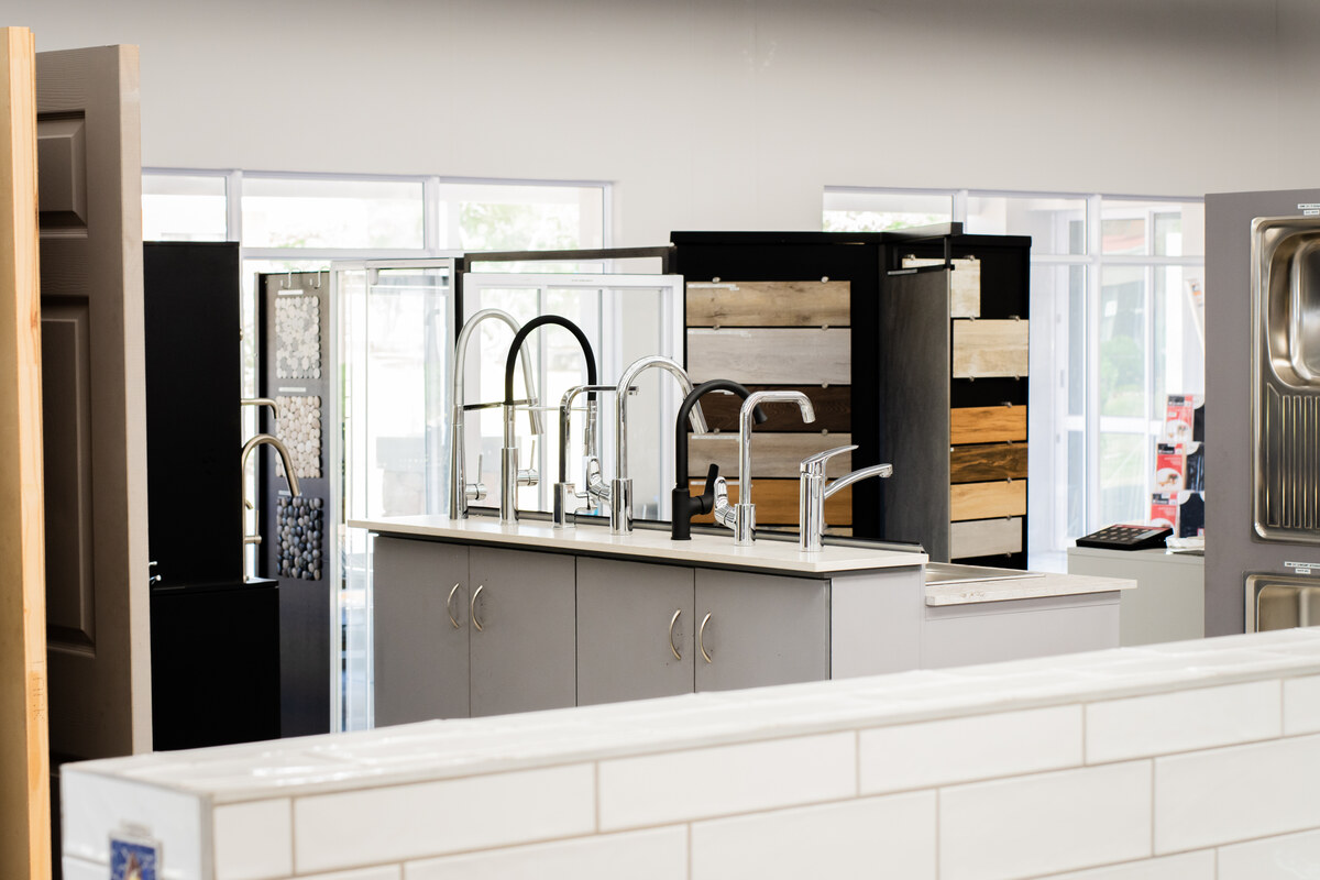 Kitchen mixer taps and tile displays in the showroom