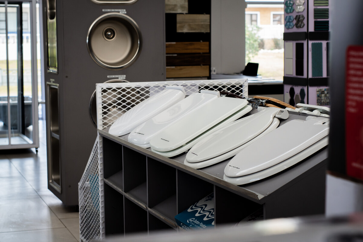 Kitchen sinks and pull-out tray on display