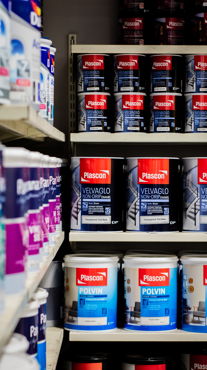 Paint tins on shelves in the paint section