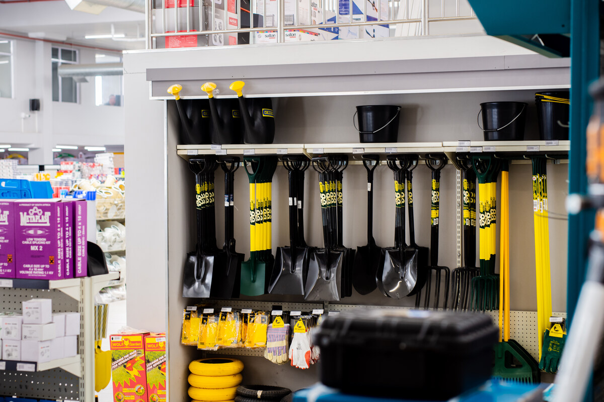 Spades and garden tools on a display rack