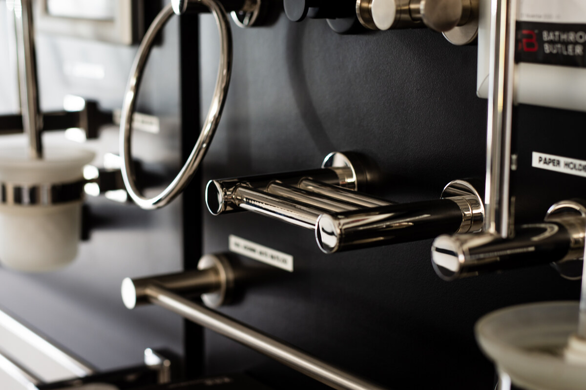 Chrome bathroom accessories on a display board