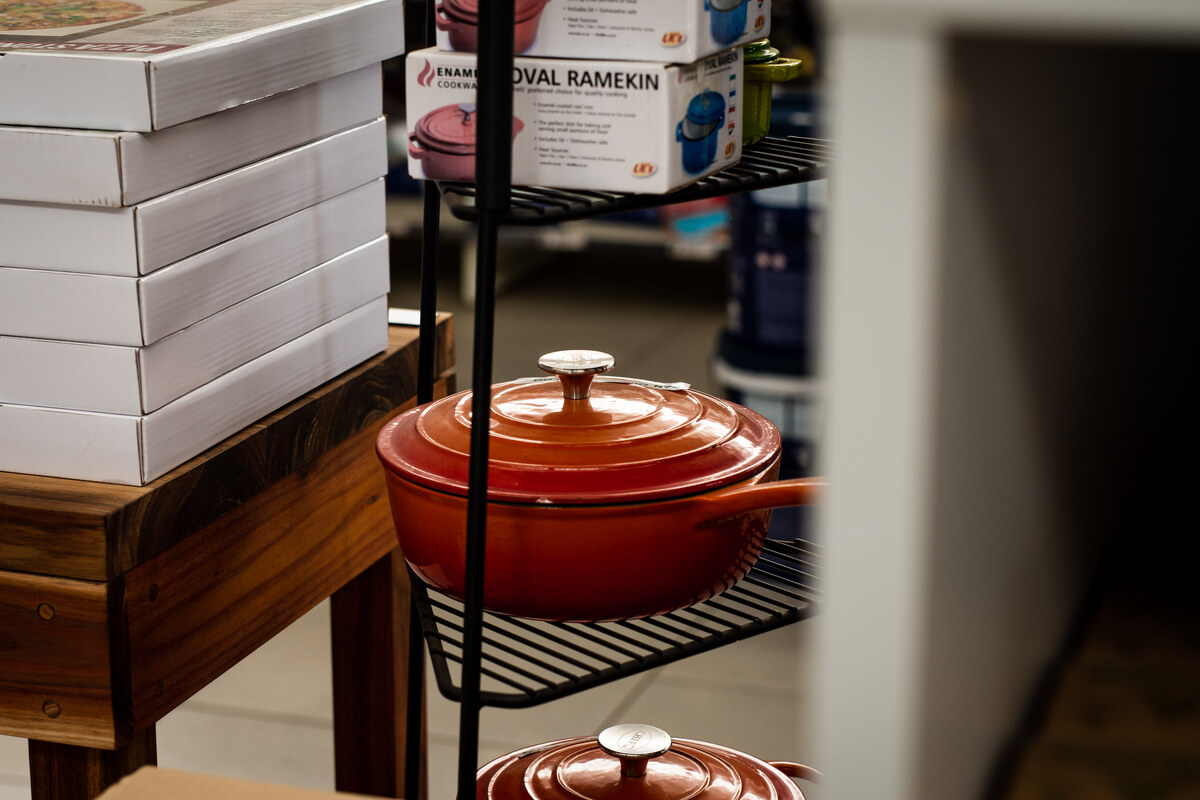 Cast-iron casserole pots on a display stand