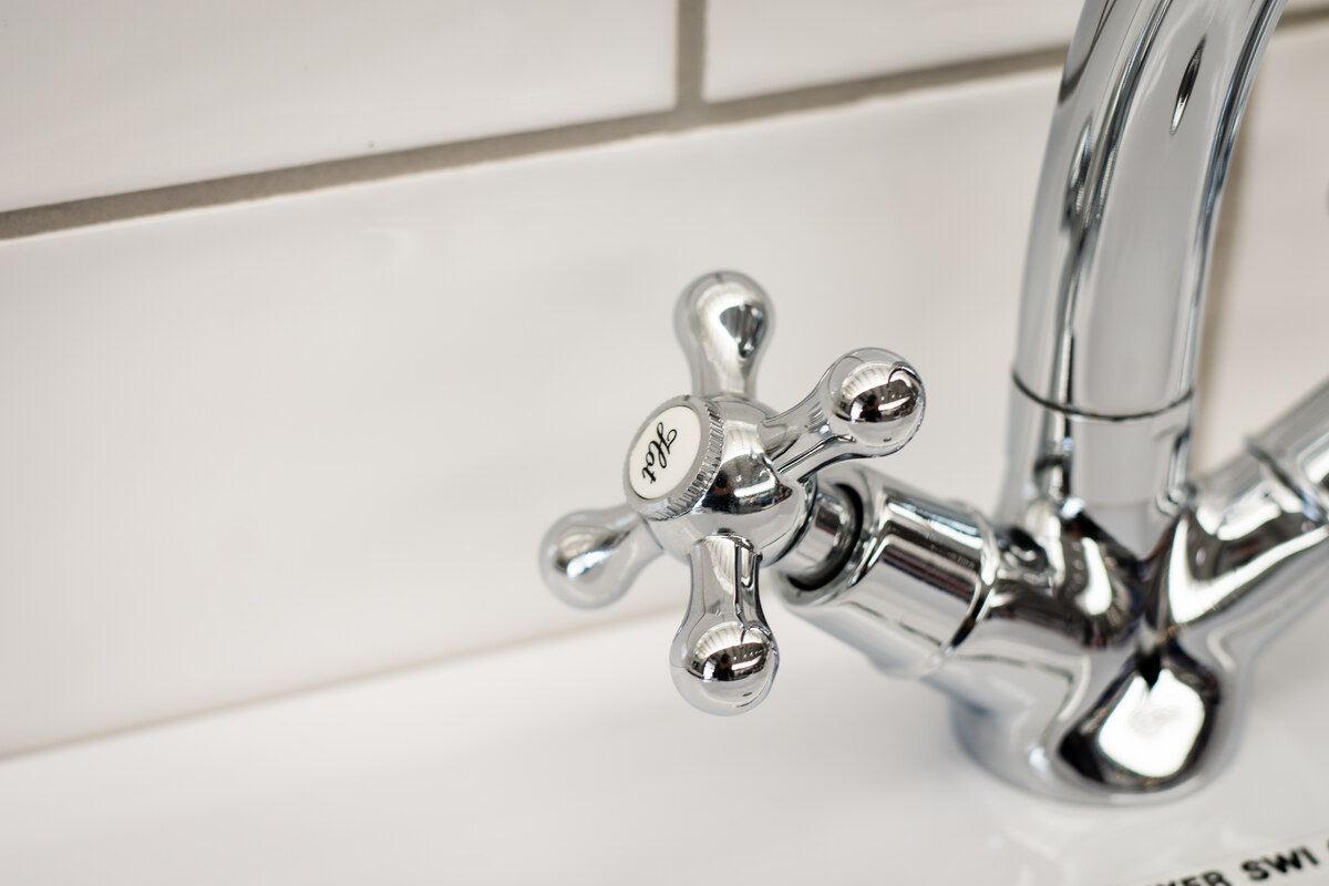 Close-up of a chrome basin tap